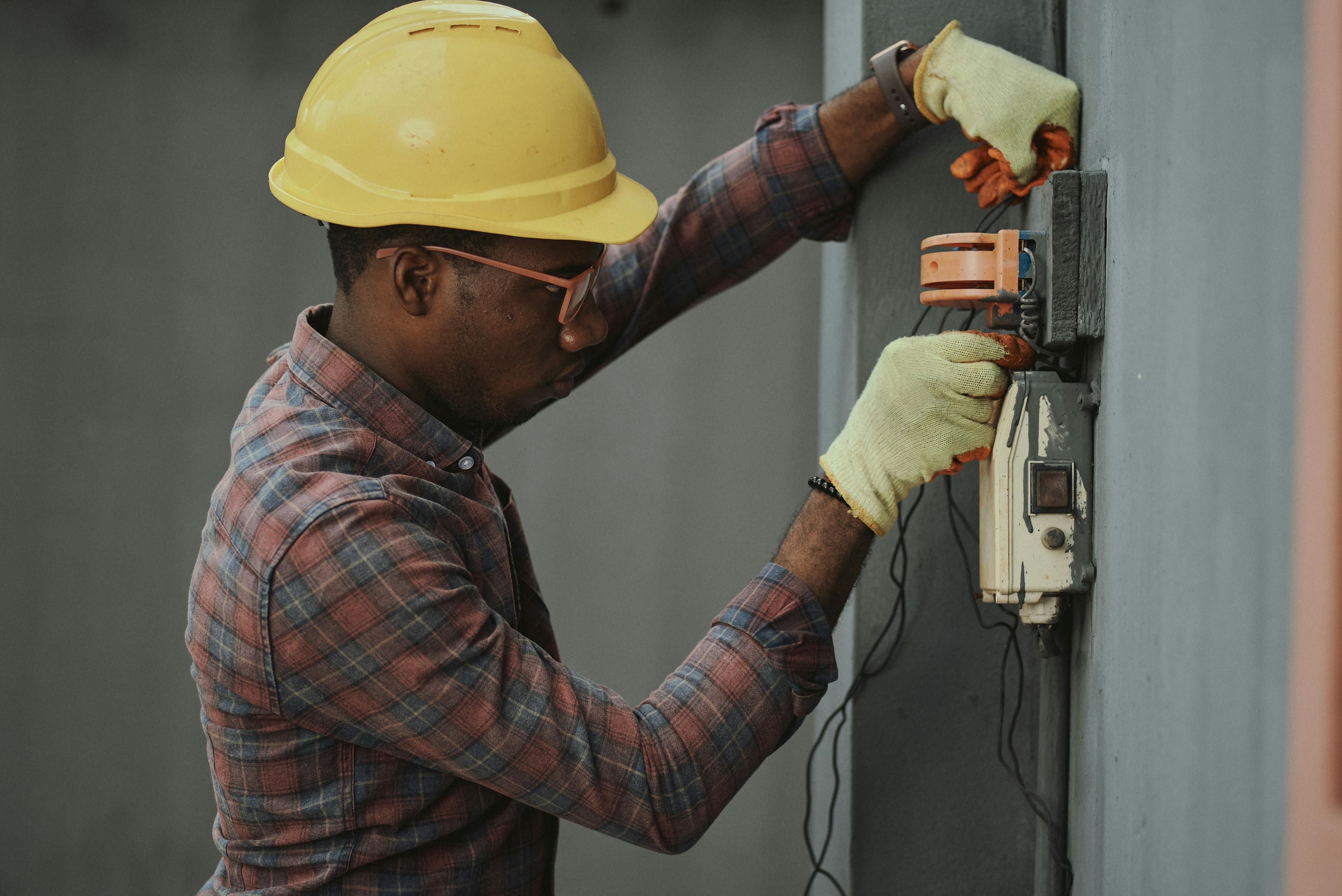 Plumber working on a residential pipe system